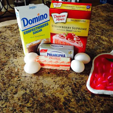 To bake the best Strawberry White Chocolate  Blondies, prepare the strawberry cake mix, confectioners sugar, butter, eggs and cheese. It is summer in a pan!