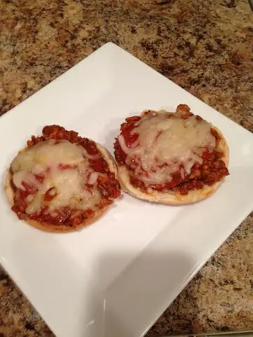 yummy pizza burgers made of ground turkey, Italian sausage, and pepperoni, and topped with melted Mozzarella cheese