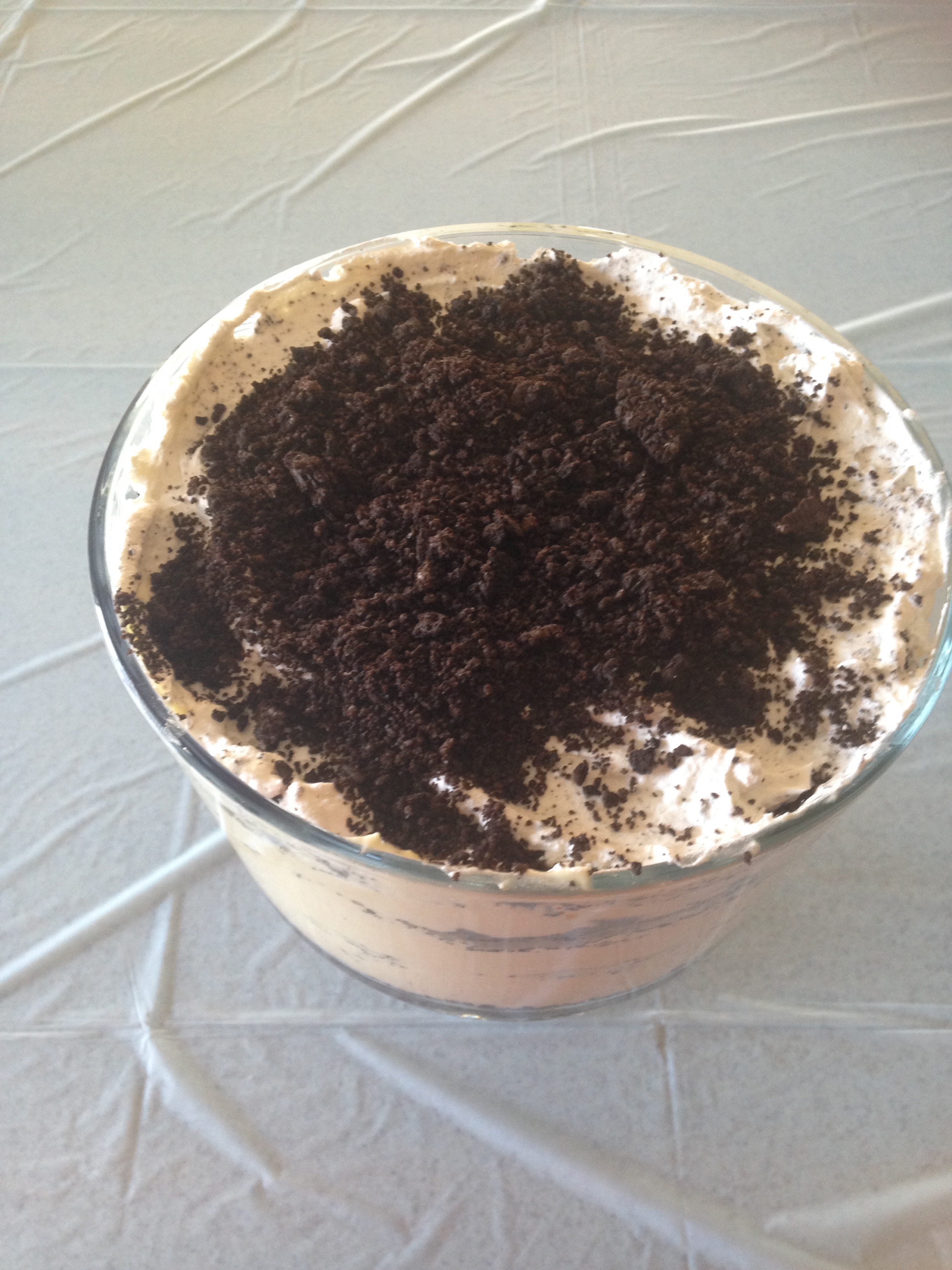 A easy no bake dessert made with cookies is ready to be served, topped with crushed Oreos